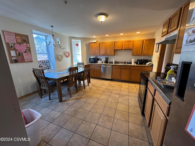 kitchen with pendant lighting, light tile patterned floors, an inviting chandelier, and black appliances