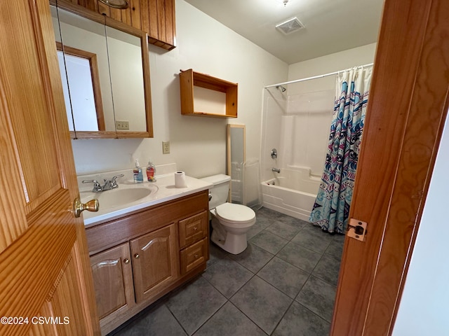 full bathroom featuring tile patterned flooring, vanity, toilet, and shower / bath combo with shower curtain