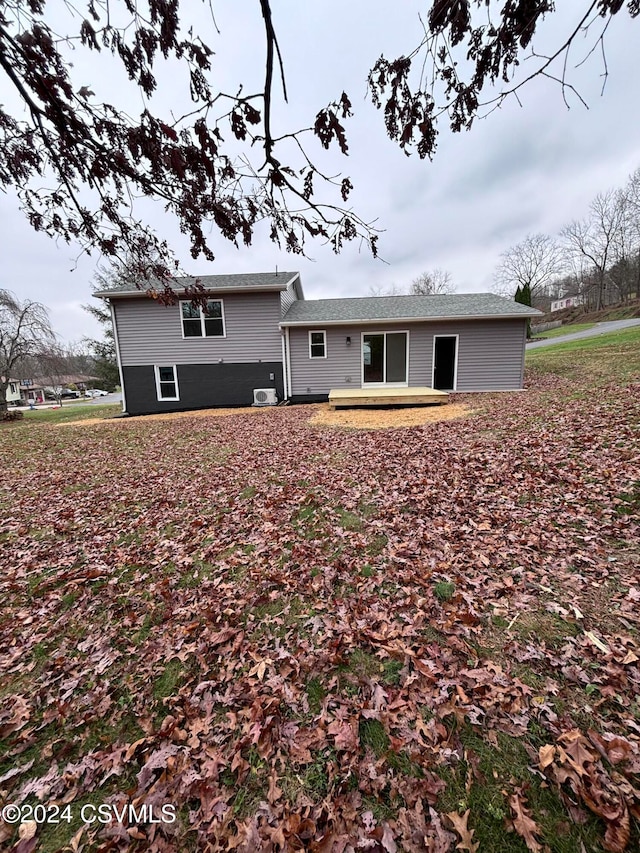 back of property with cooling unit