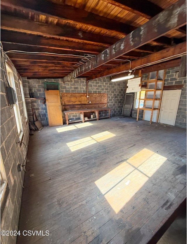 interior space featuring beamed ceiling, wooden ceiling, and hardwood / wood-style flooring