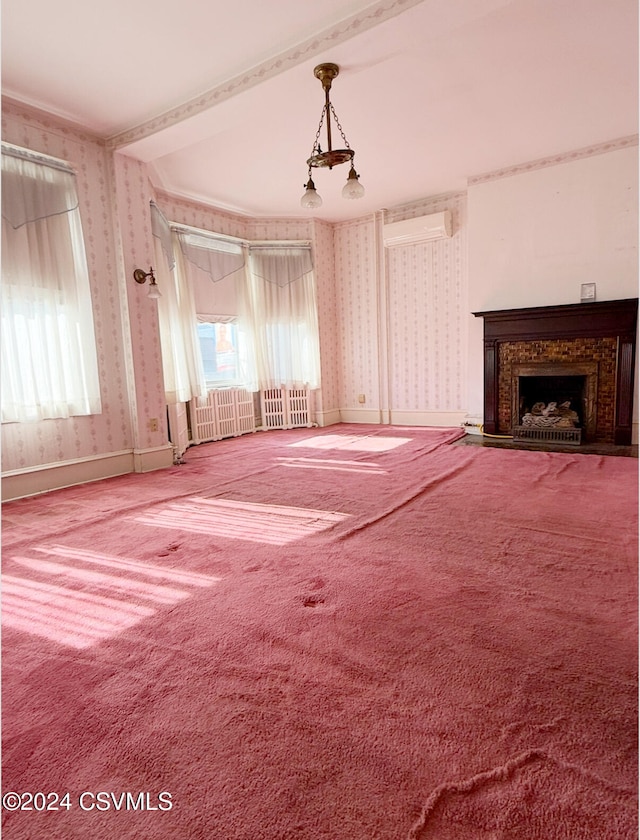 unfurnished living room featuring carpet flooring, radiator heating unit, and an AC wall unit