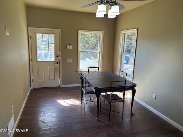 dining space with dark hardwood / wood-style floors and ceiling fan