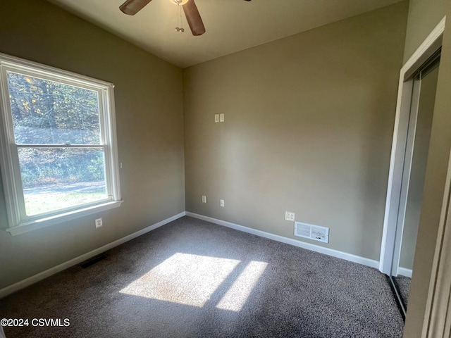 carpeted empty room with ceiling fan