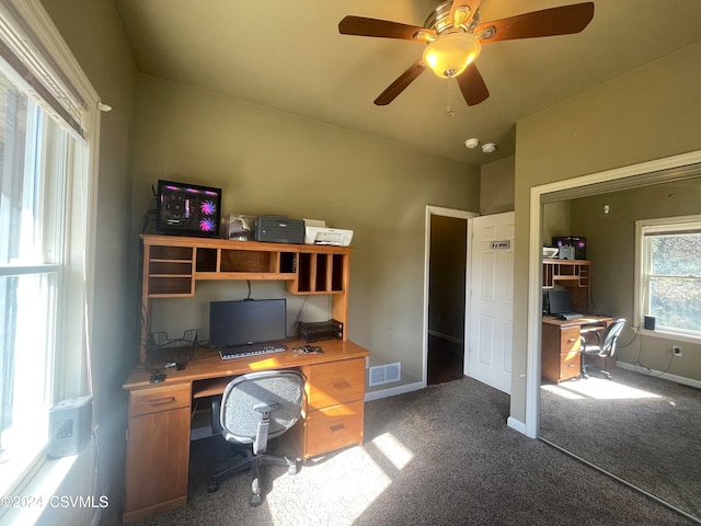 carpeted office with ceiling fan