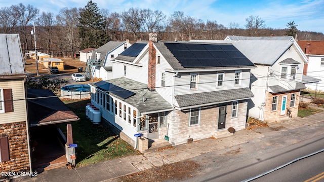 exterior space featuring solar panels and a trampoline