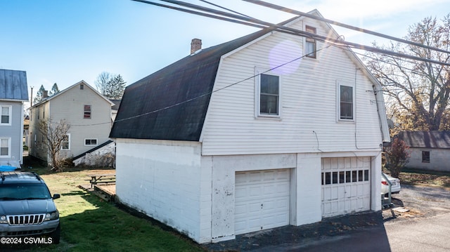 view of side of home with a garage