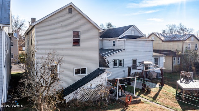 rear view of property featuring a gazebo