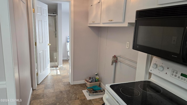 kitchen with white cabinets and white electric range