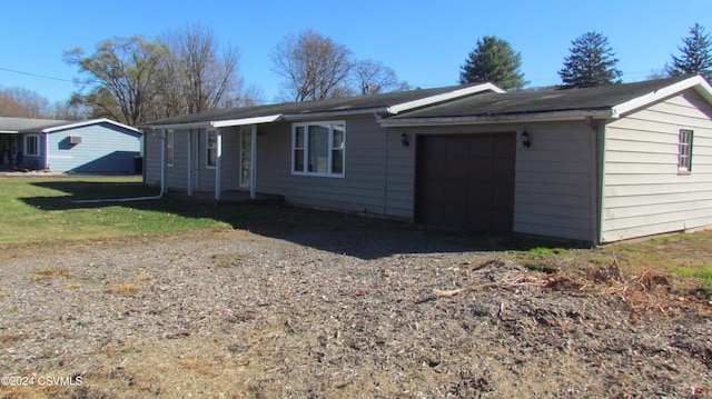 ranch-style house featuring a garage