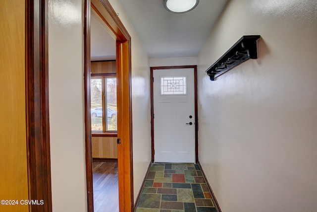 doorway with dark hardwood / wood-style floors