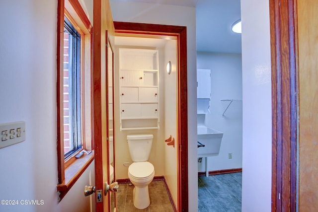 bathroom with tile patterned flooring and toilet