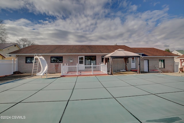 back of house featuring a gazebo, a patio, and a covered pool