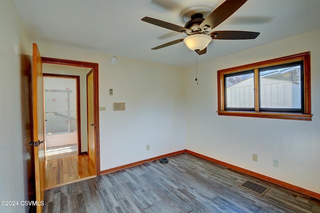 unfurnished room with hardwood / wood-style floors and ceiling fan