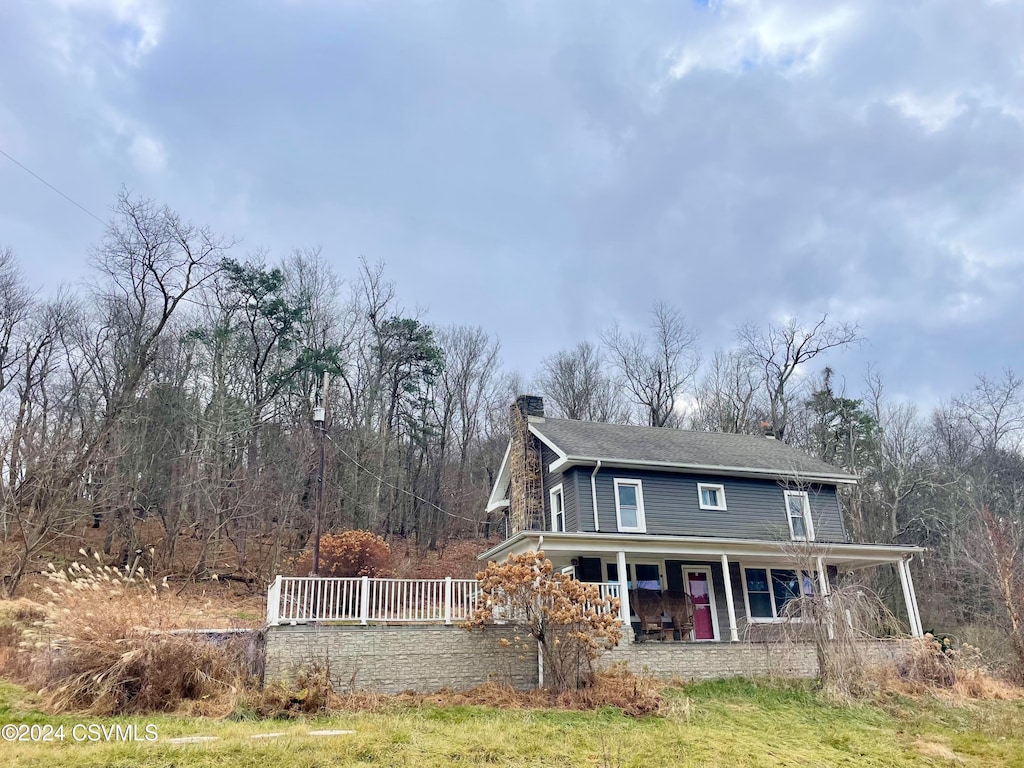 view of front of property featuring covered porch