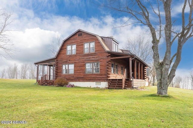 view of side of property with a yard