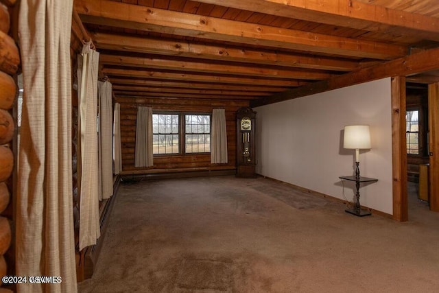 miscellaneous room featuring beam ceiling, carpet, and wood ceiling