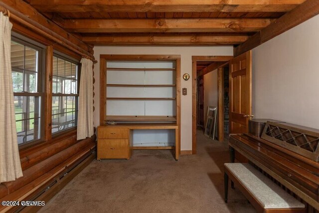 interior space featuring light carpet, beamed ceiling, and wood ceiling