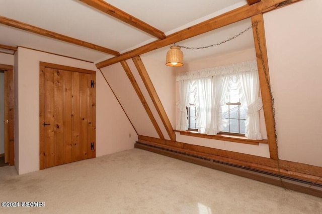 bonus room featuring carpet flooring and beamed ceiling