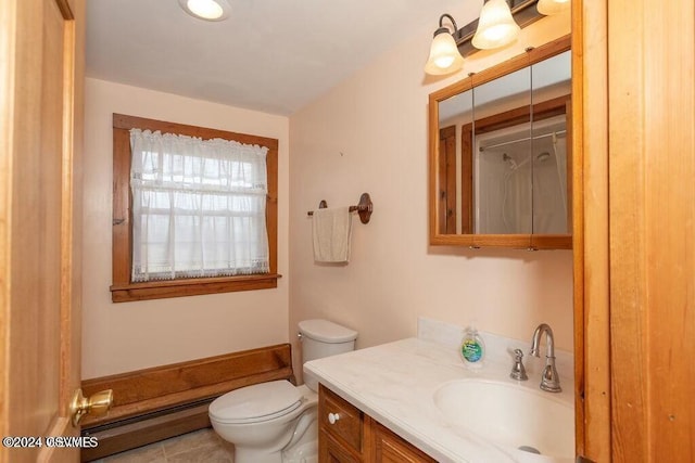 bathroom featuring tile patterned floors, vanity, toilet, and a baseboard heating unit