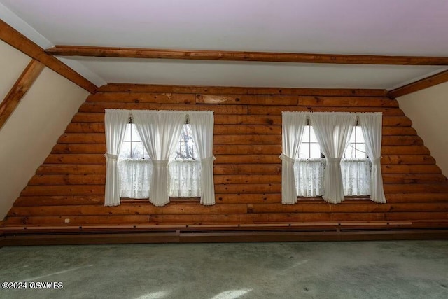 bonus room with lofted ceiling with beams, log walls, and dark carpet