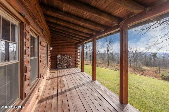 wooden terrace with a yard