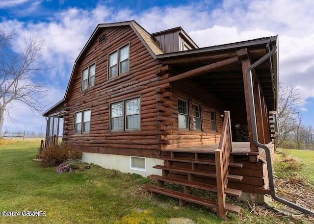 view of home's exterior with a yard