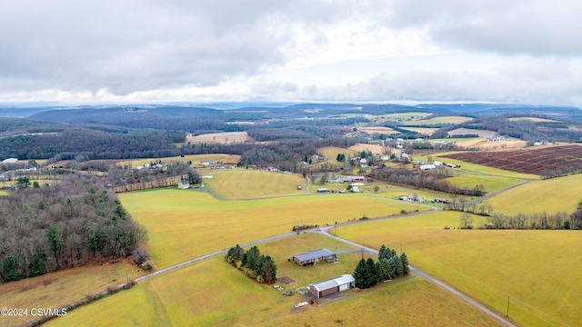 birds eye view of property featuring a mountain view and a rural view