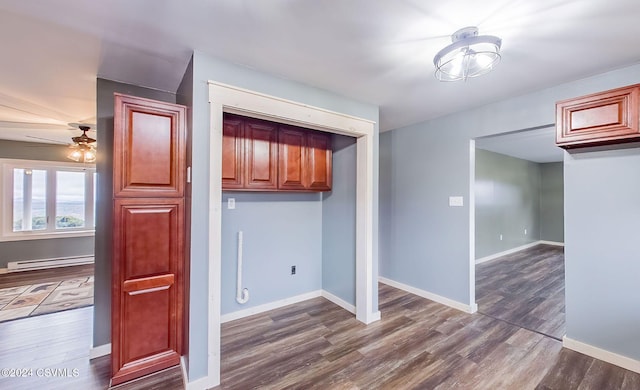 kitchen featuring ceiling fan, dark hardwood / wood-style flooring, and a baseboard radiator