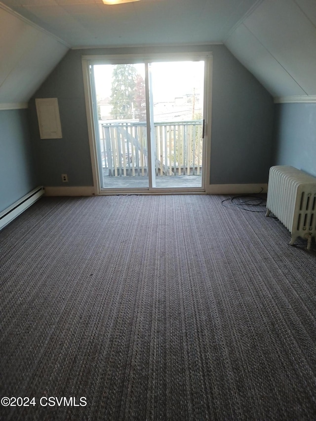 bonus room featuring a baseboard heating unit, radiator heating unit, vaulted ceiling, and dark colored carpet