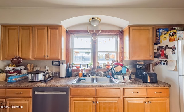 kitchen with dishwasher, decorative backsplash, white refrigerator, and sink