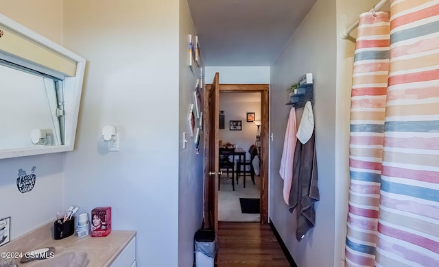 bathroom featuring vanity and wood-type flooring