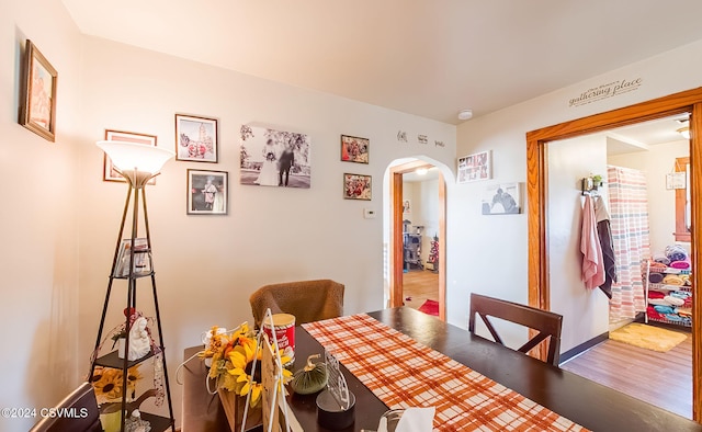 dining area with hardwood / wood-style flooring