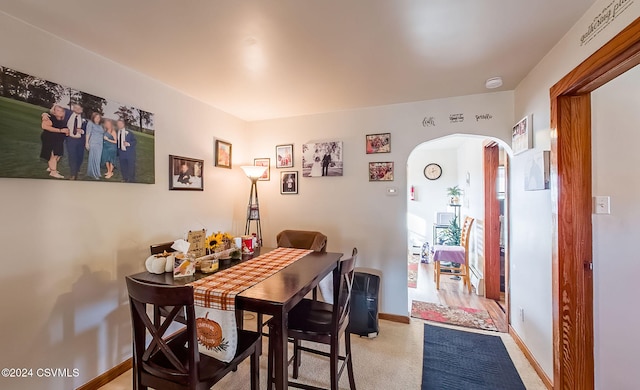 dining room featuring light colored carpet