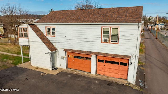 view of property exterior featuring a garage