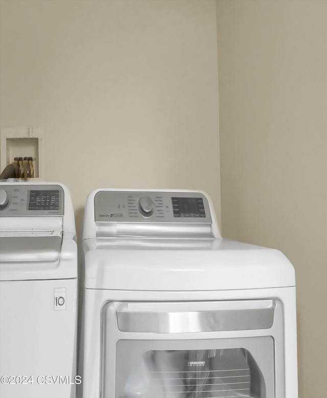 clothes washing area featuring washer and dryer