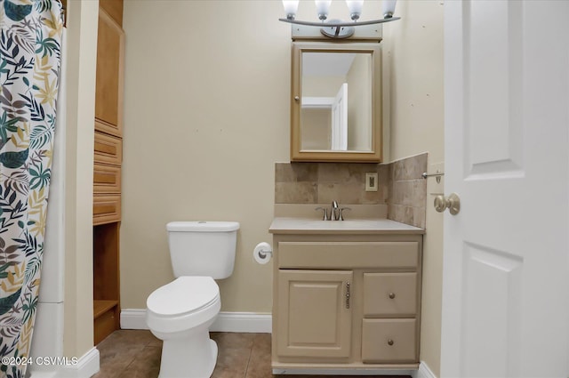 bathroom with backsplash, tile patterned flooring, vanity, and toilet