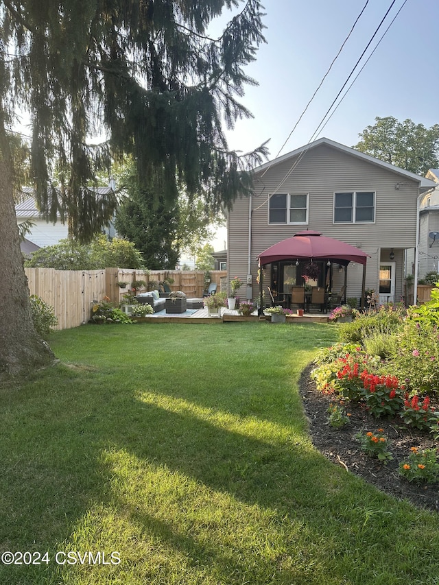 view of yard with a gazebo, an outdoor living space, and a patio