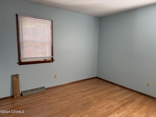 unfurnished room with light hardwood / wood-style flooring