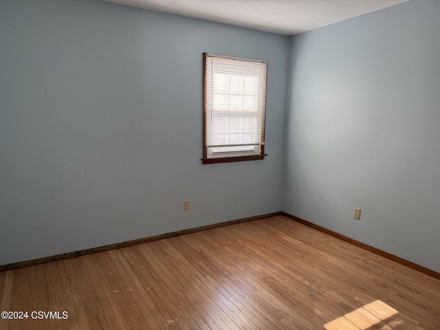 unfurnished room featuring light hardwood / wood-style floors