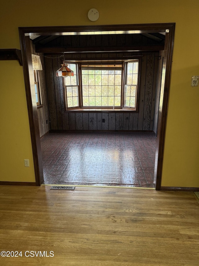 unfurnished room featuring hardwood / wood-style flooring