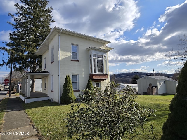 view of property exterior featuring a yard