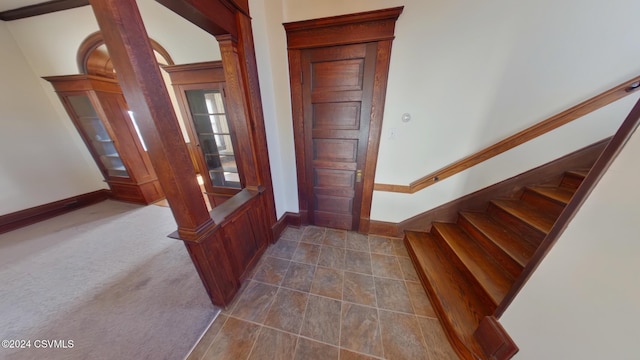 view of carpeted foyer