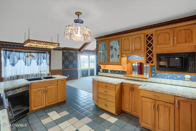 kitchen with pendant lighting, light tile patterned floors, black appliances, and sink