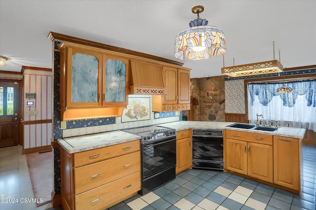 kitchen featuring sink, decorative light fixtures, light tile patterned flooring, black appliances, and custom range hood