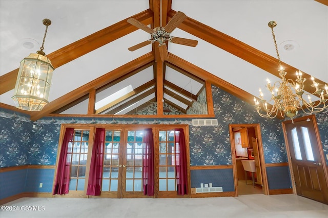 interior space with high vaulted ceiling, french doors, ceiling fan with notable chandelier, a wealth of natural light, and beamed ceiling