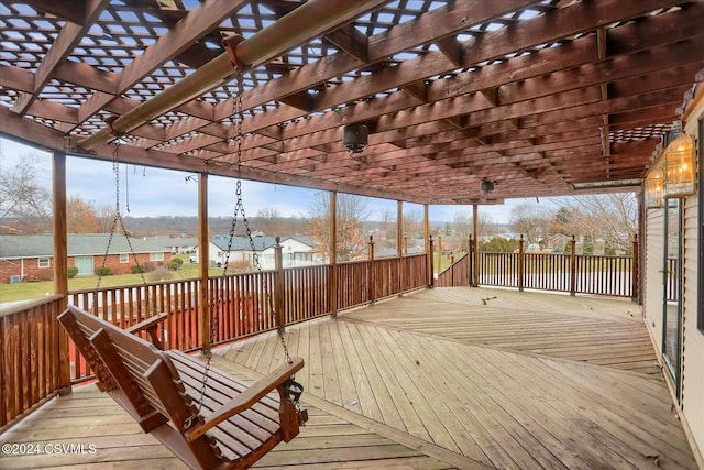 wooden deck featuring a pergola