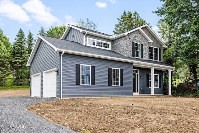 151 Hillside Ave, Elysburg, PA 17824 - view of front of property with a porch, a garage, gravel driveway, and roof with shingles