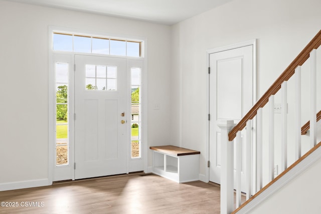 151 Hillside Ave, Elysburg, PA 17824 - foyer featuring healthy amount of natural light, wood finished floors, stairs, and baseboards