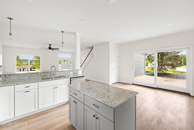 151 Hillside Ave, Elysburg, PA 17824 - kitchen featuring a sink, stainless steel dishwasher, ceiling fan, light wood-style floors, and pendant lighting
