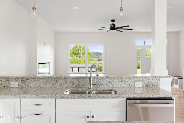151 Hillside Ave, Elysburg, PA 17824 - kitchen featuring dishwasher, a sink, light stone countertops, white cabinets, and a ceiling fan